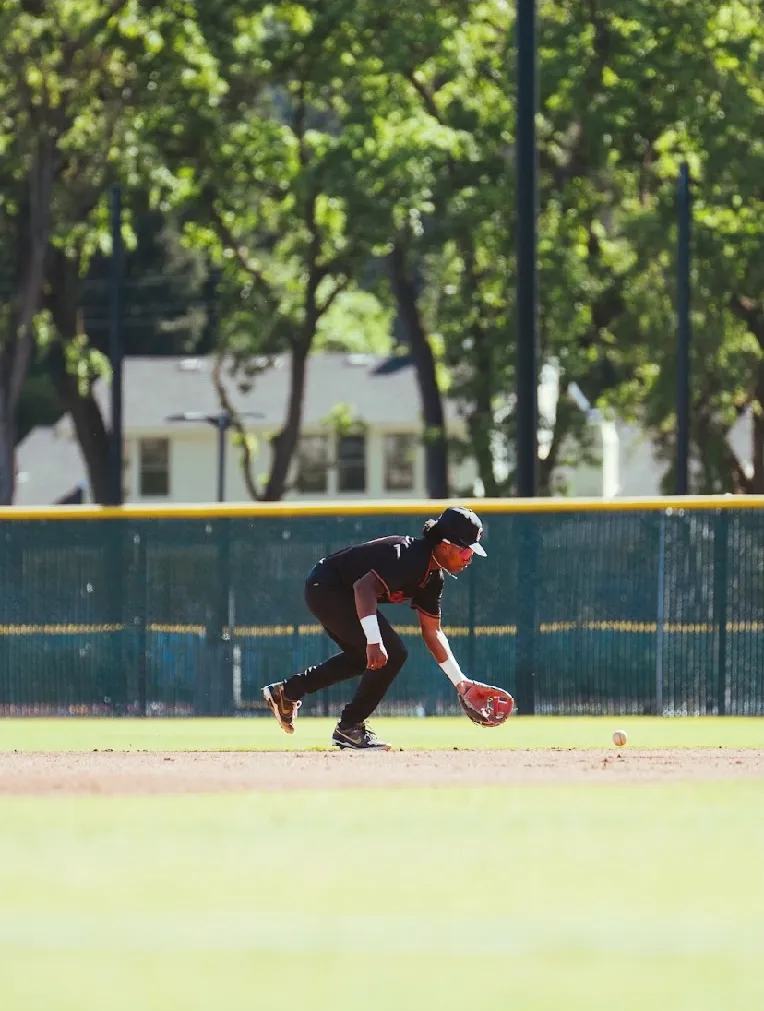 Kai Watts fielding a ground ball at shortstop