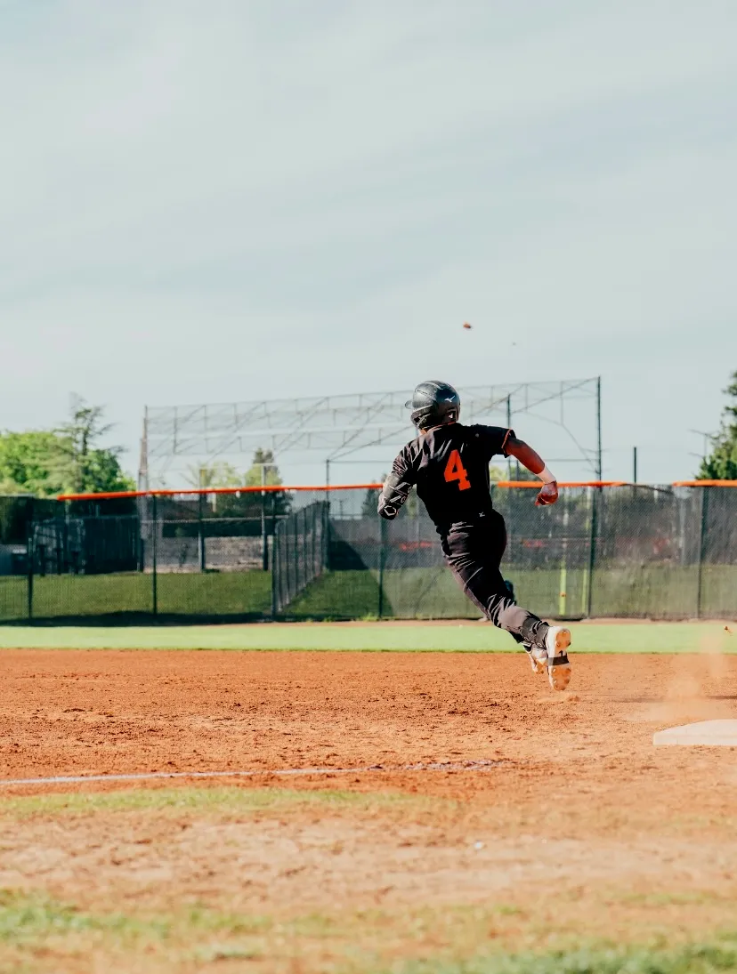 Kai Watts, #4, running the bases at full speed