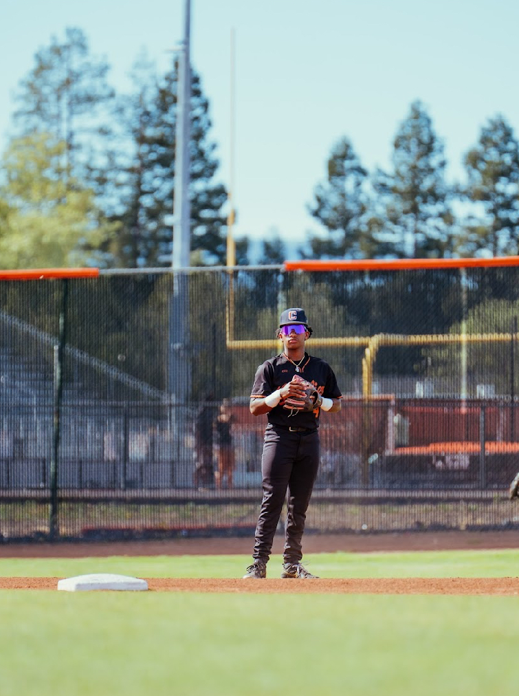 Kai Watts standing on the infield between innings