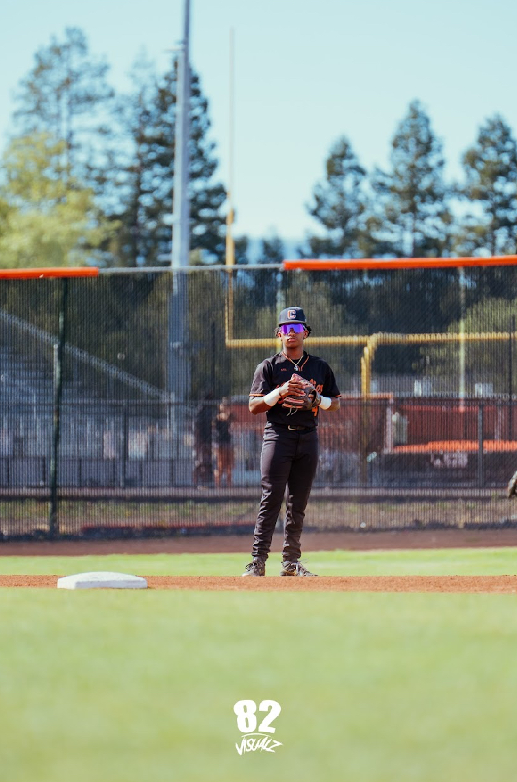 Kai Watts standing on the infield between innings