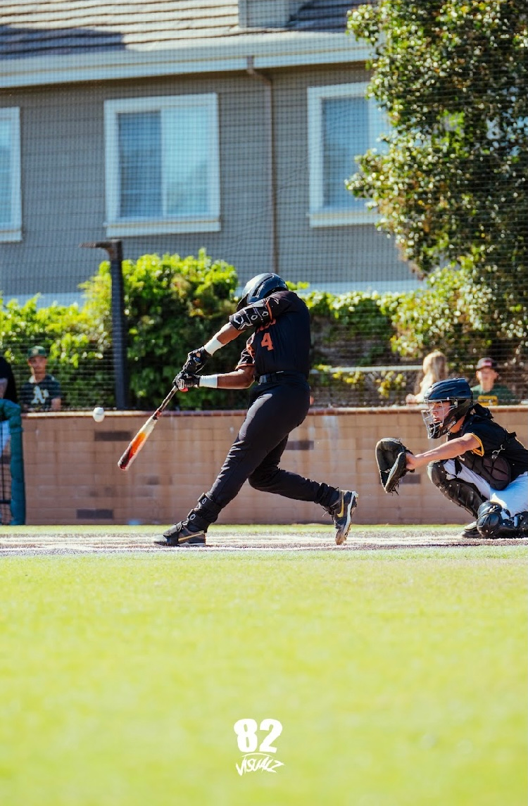 Kai Watts, #4, making contact at the plate