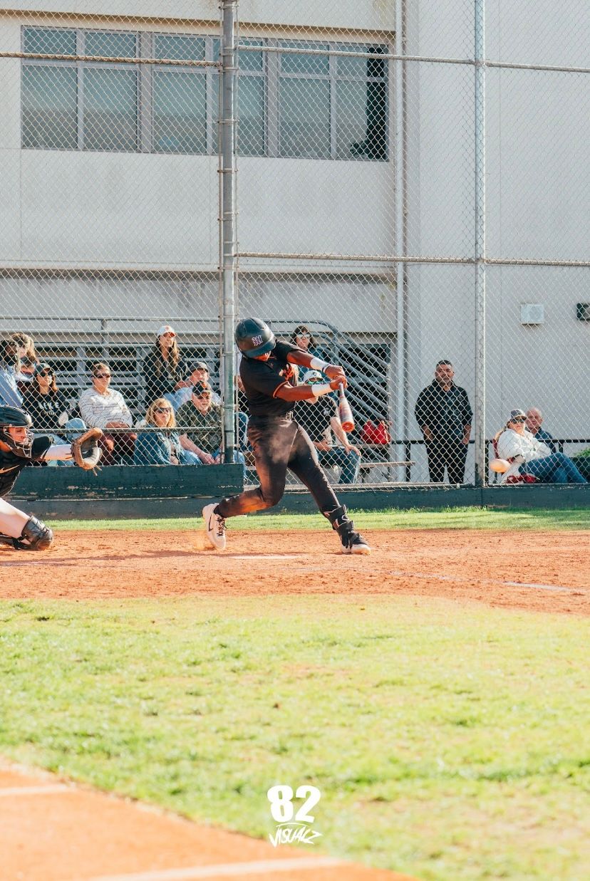 Kai Watts swinging at a pitch
