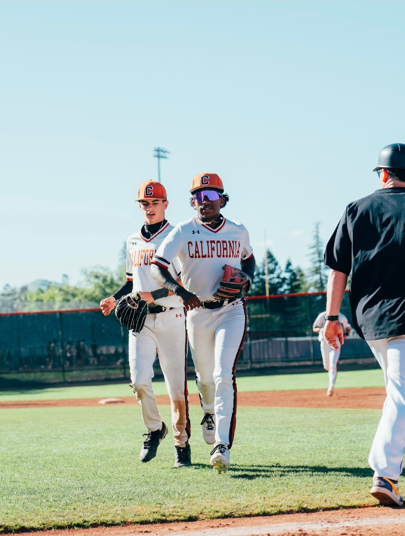 Kai Watts walking off the field with teammates