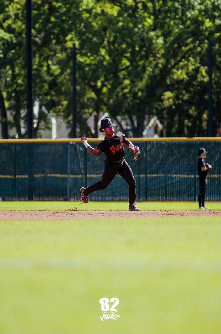 Kai Watts making a throw from shortstop