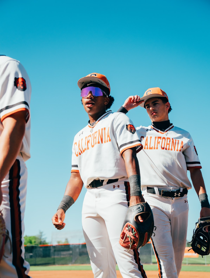 Kai Watts walking with teammates between innings